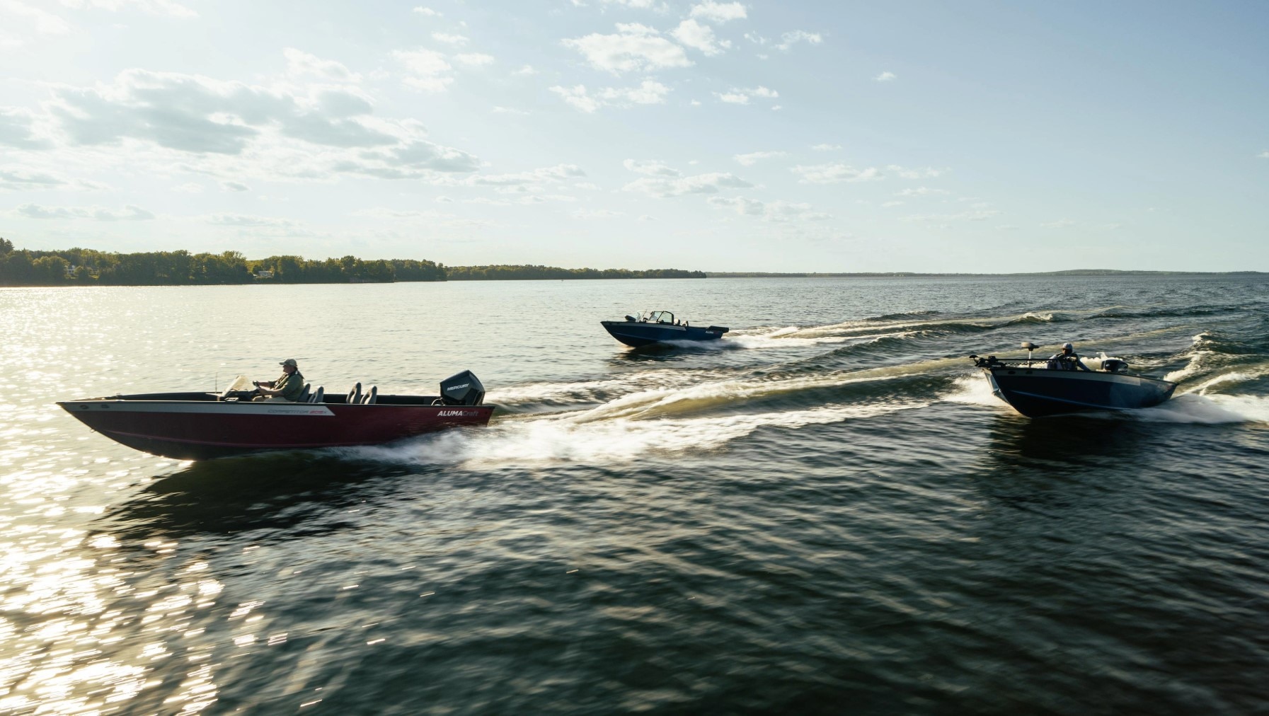 The 2025 family of Alumacraft fishing boats, sailing through the water at top speed