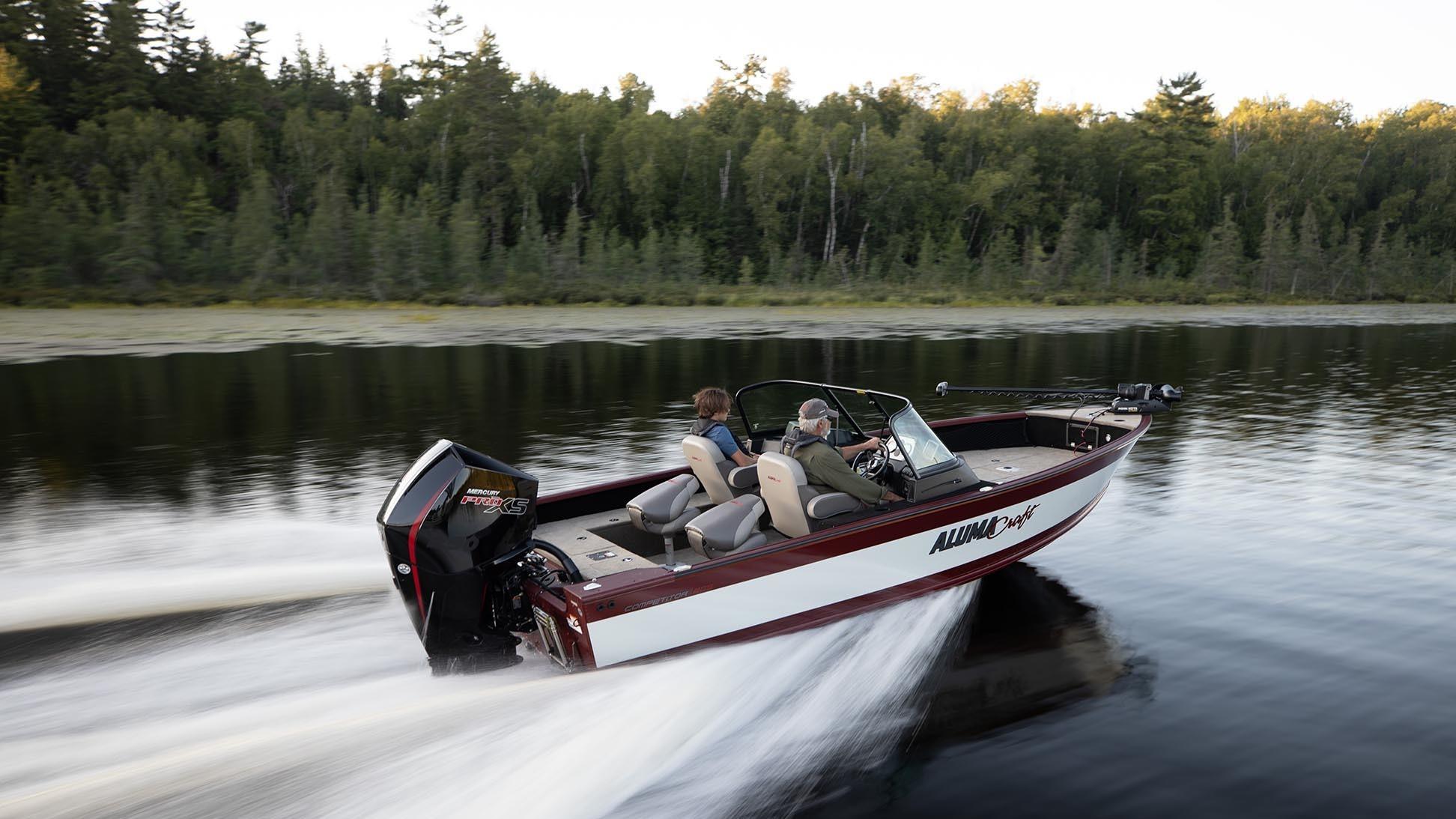 Man and his son going fast with an Alumacraft Competitor