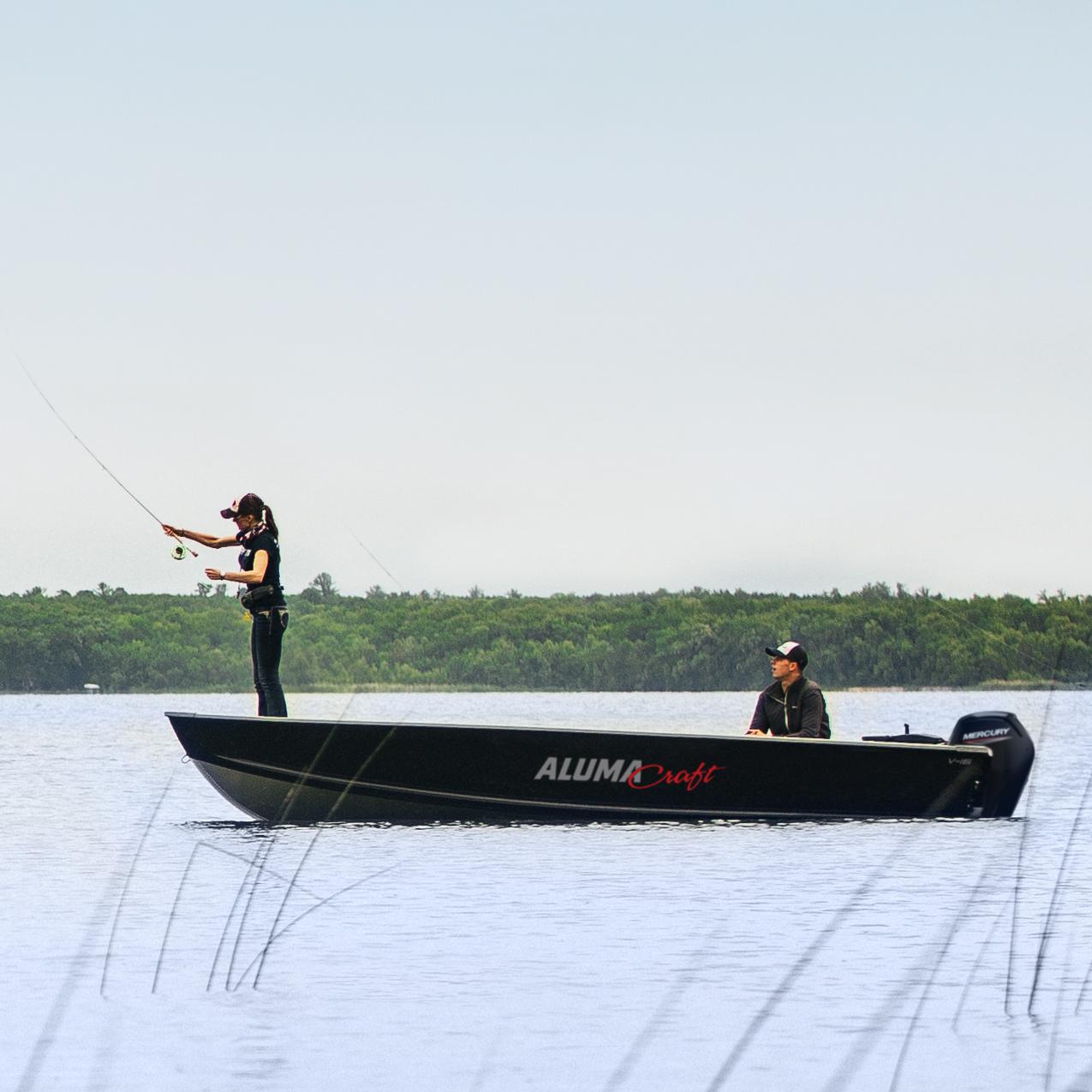 Couple flyfishing on their Alumacraft boat