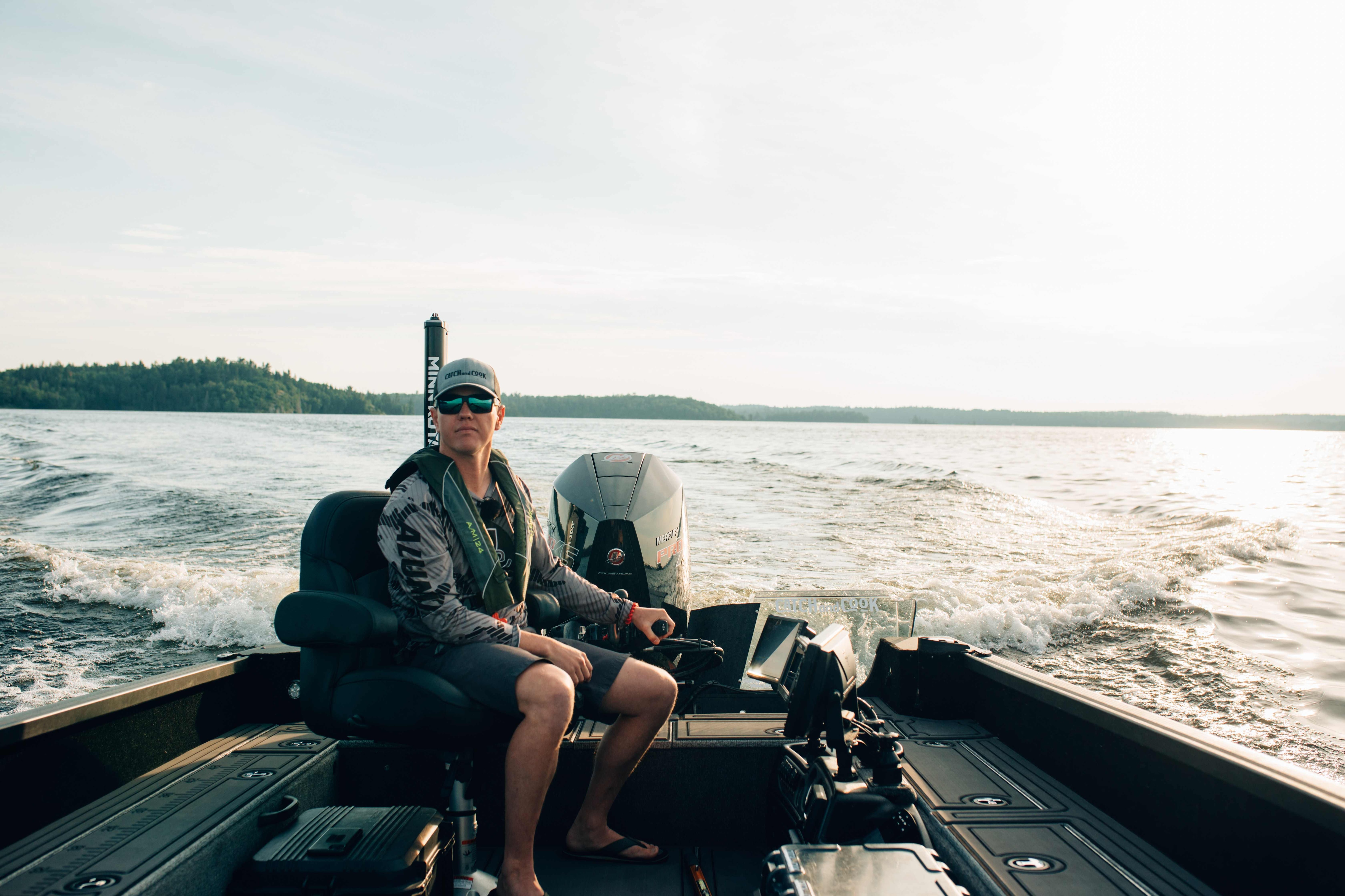 Jay Siemens boating in Alumacraft Competitor on a fishing day trip