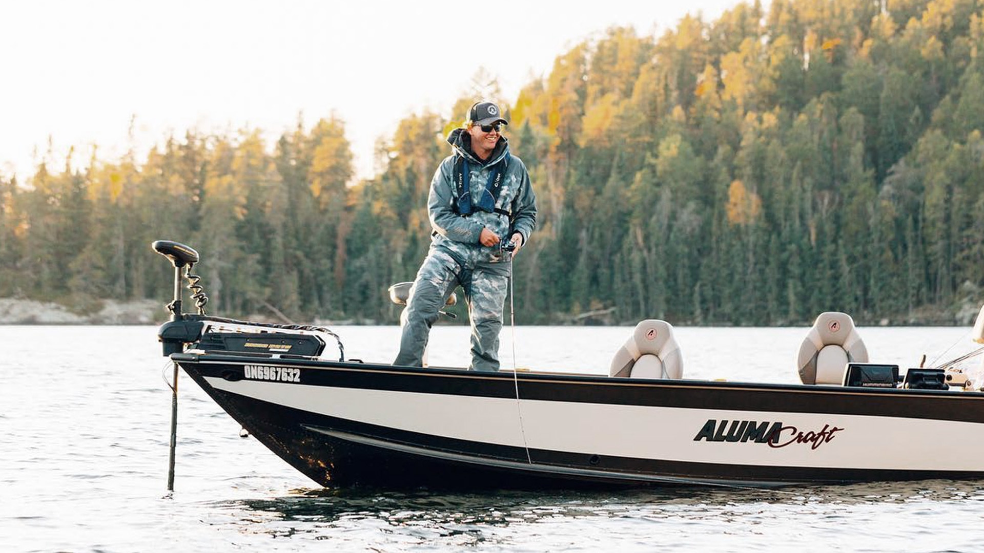 Jay Siemens fishing while standing on his Alumacraft boat