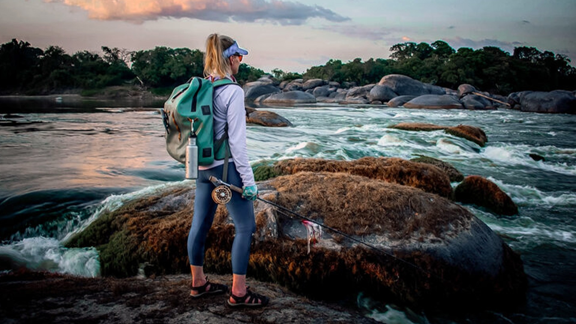 Alumacraft ambassador Rebekka Redd staring at a lake thinking about her next fishing trip