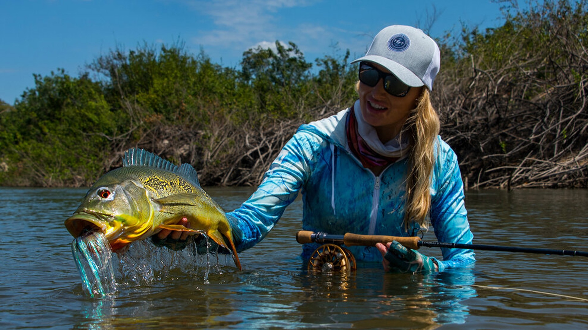 Rebekka Redd, Alumacraft ambassador, showing her off one of her many catch