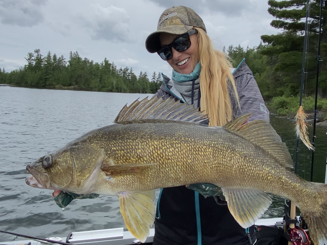 Rebekka Redd showing off her catch on alumacraft boat