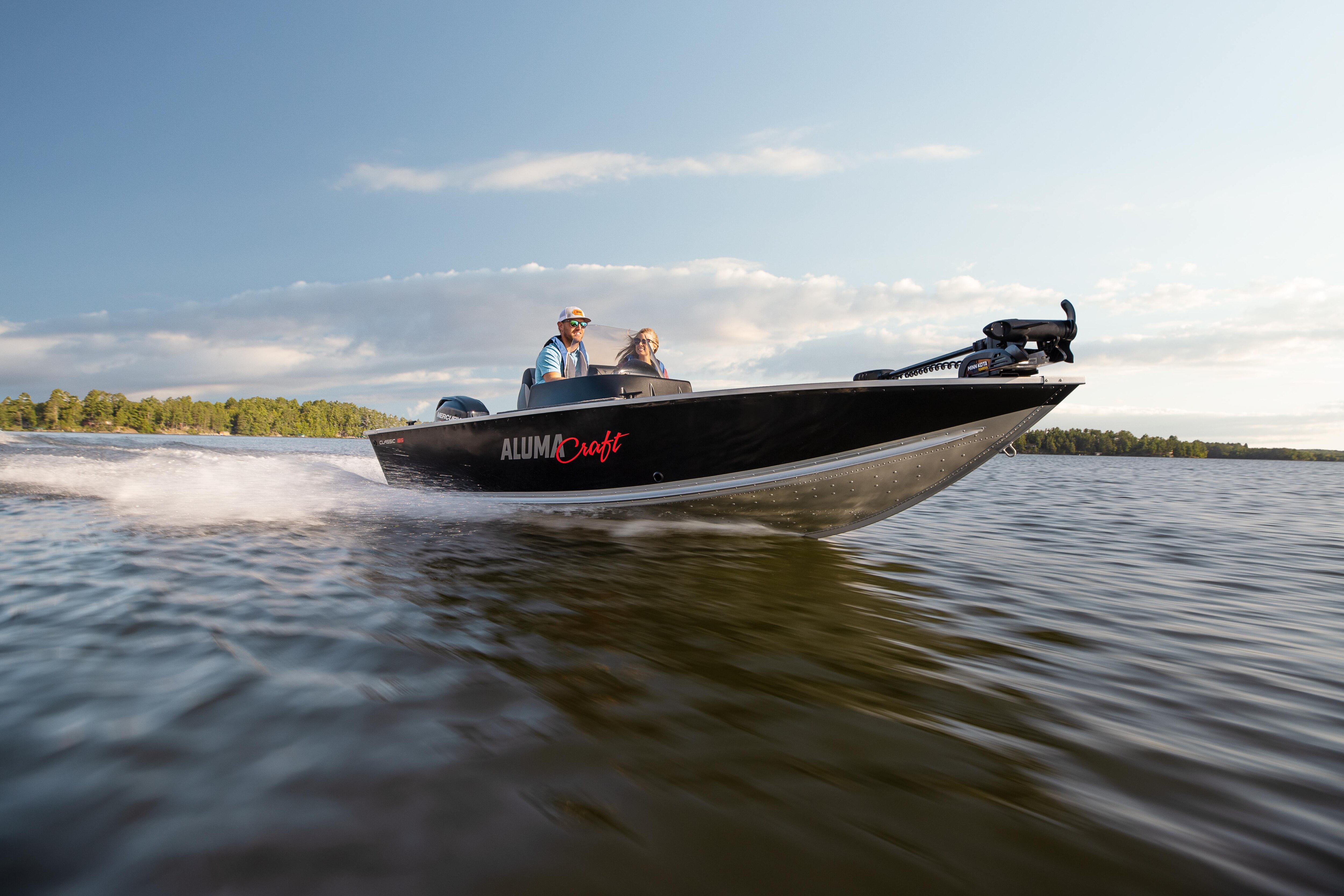 Couple driving a fishing boat