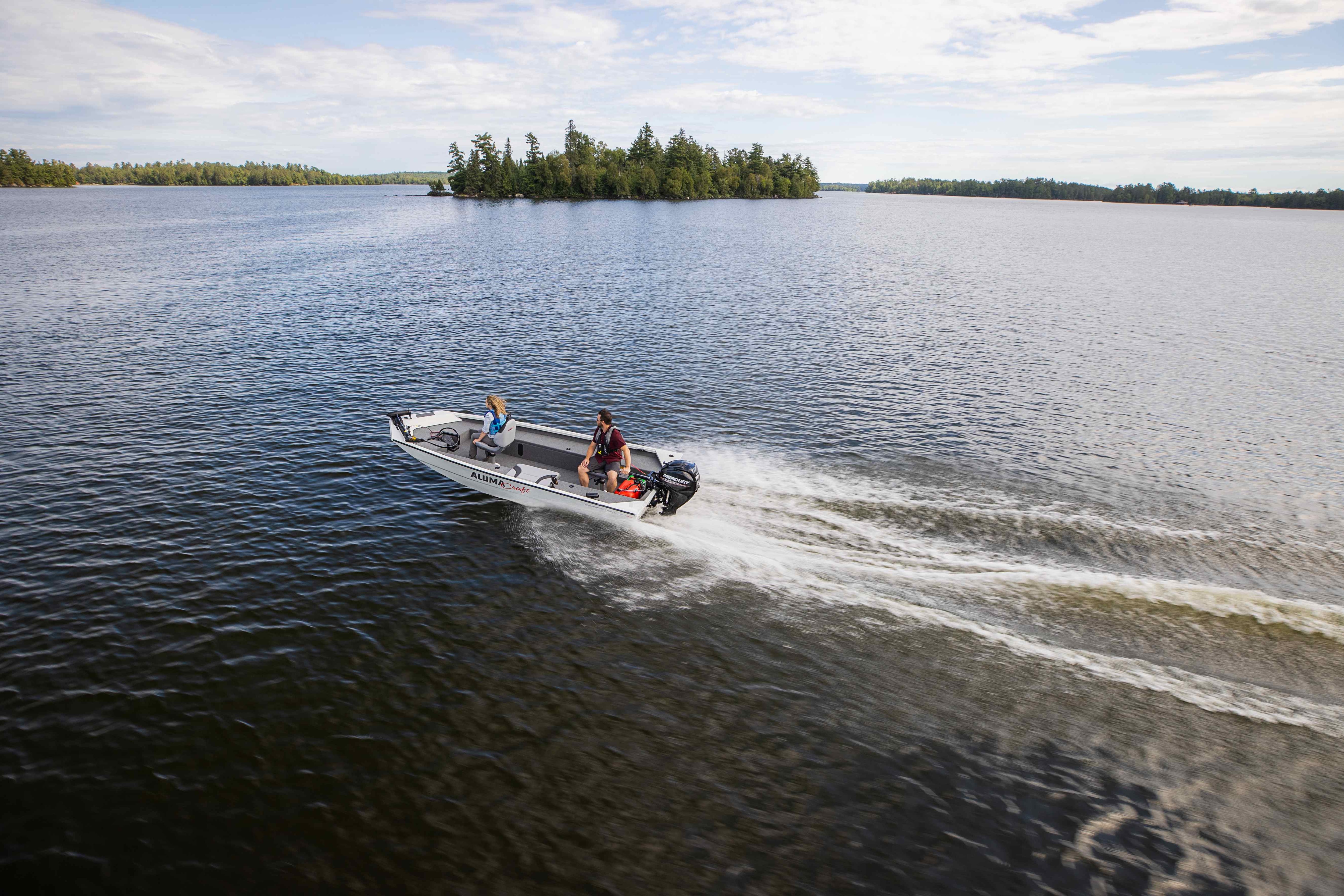 man driving with his daughter a bass & crappie Deluxe boat