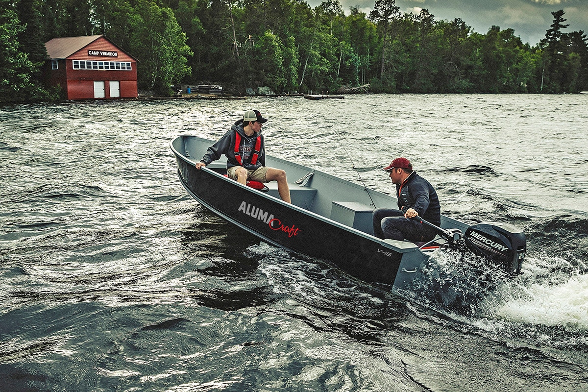 Dad and son with Alumacraft Hunt Utility boat on Rough water