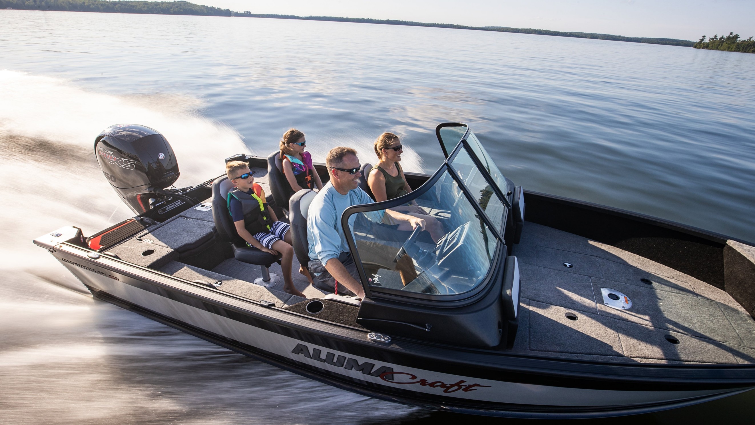 Family during a ride with a Alumacraft Fishing Boat