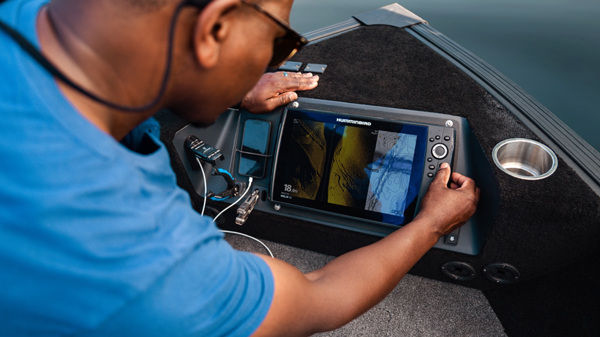 Fisherman using the Bow Control Center in his 2023 Alumacraft fishing boat