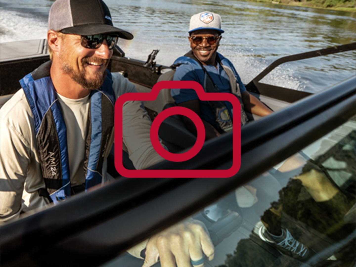 Two friends driving an Alumacraft Competitor fishing boat