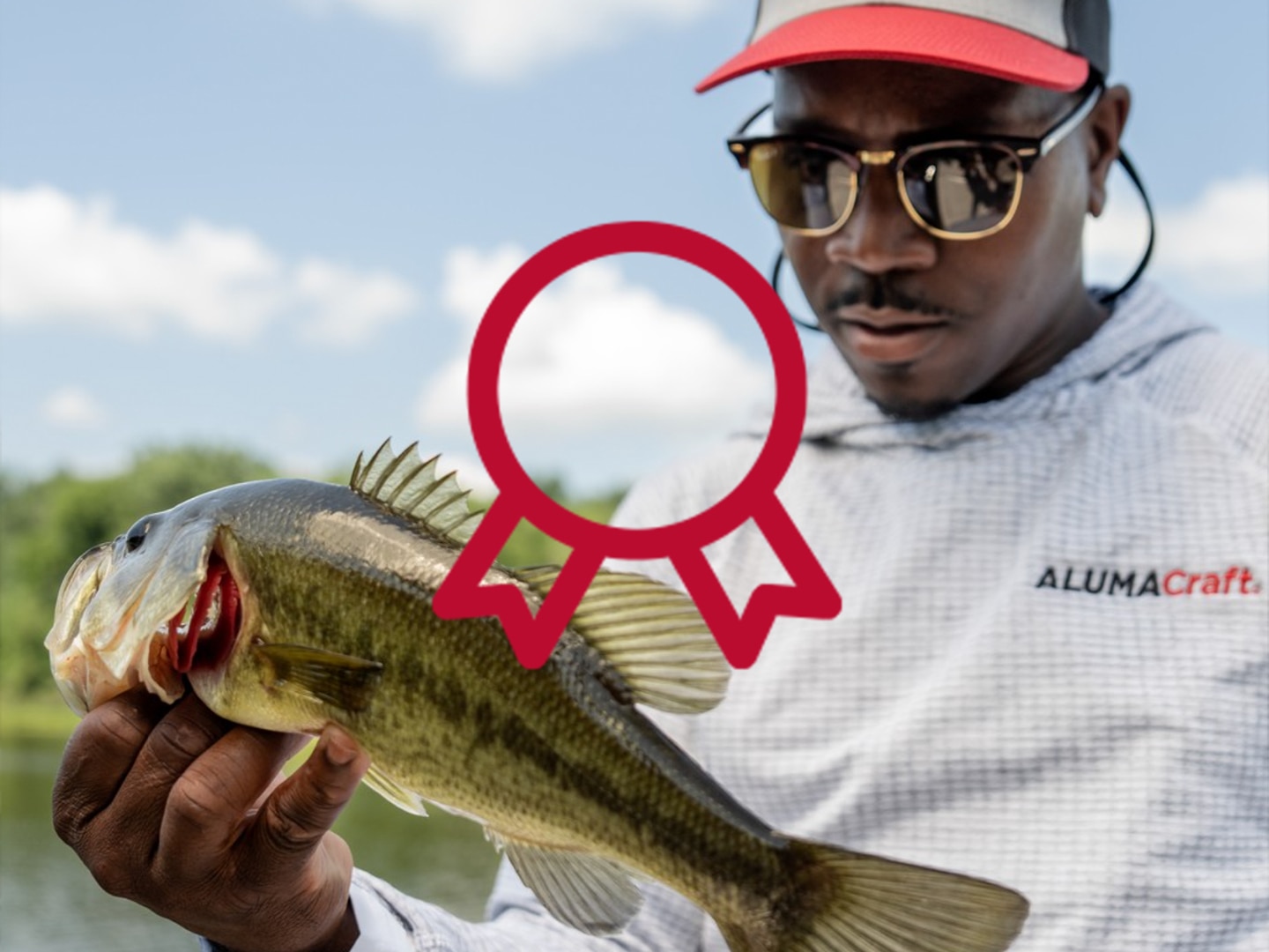 Angler showing off their catch on alumacraft fishing boat.