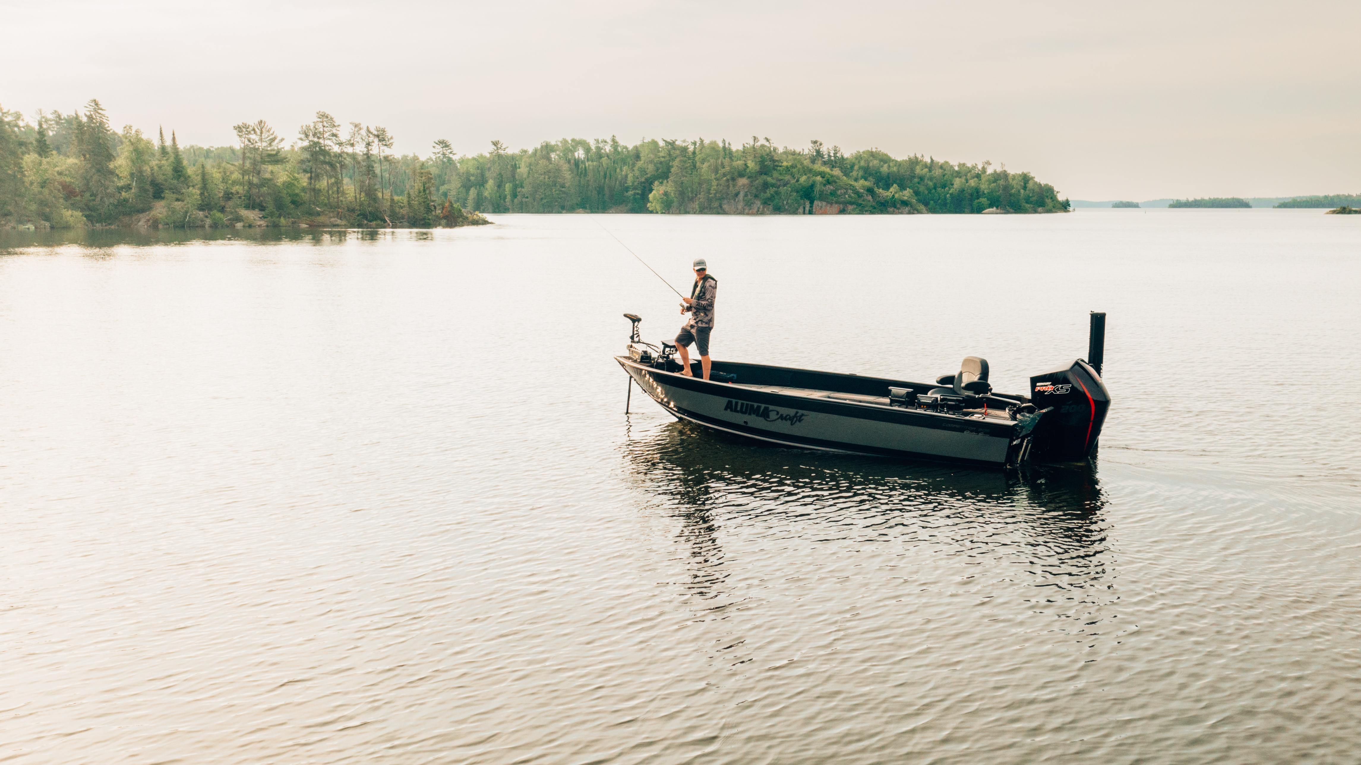 Jay Siemens fishing from his Alumacraft on lake 