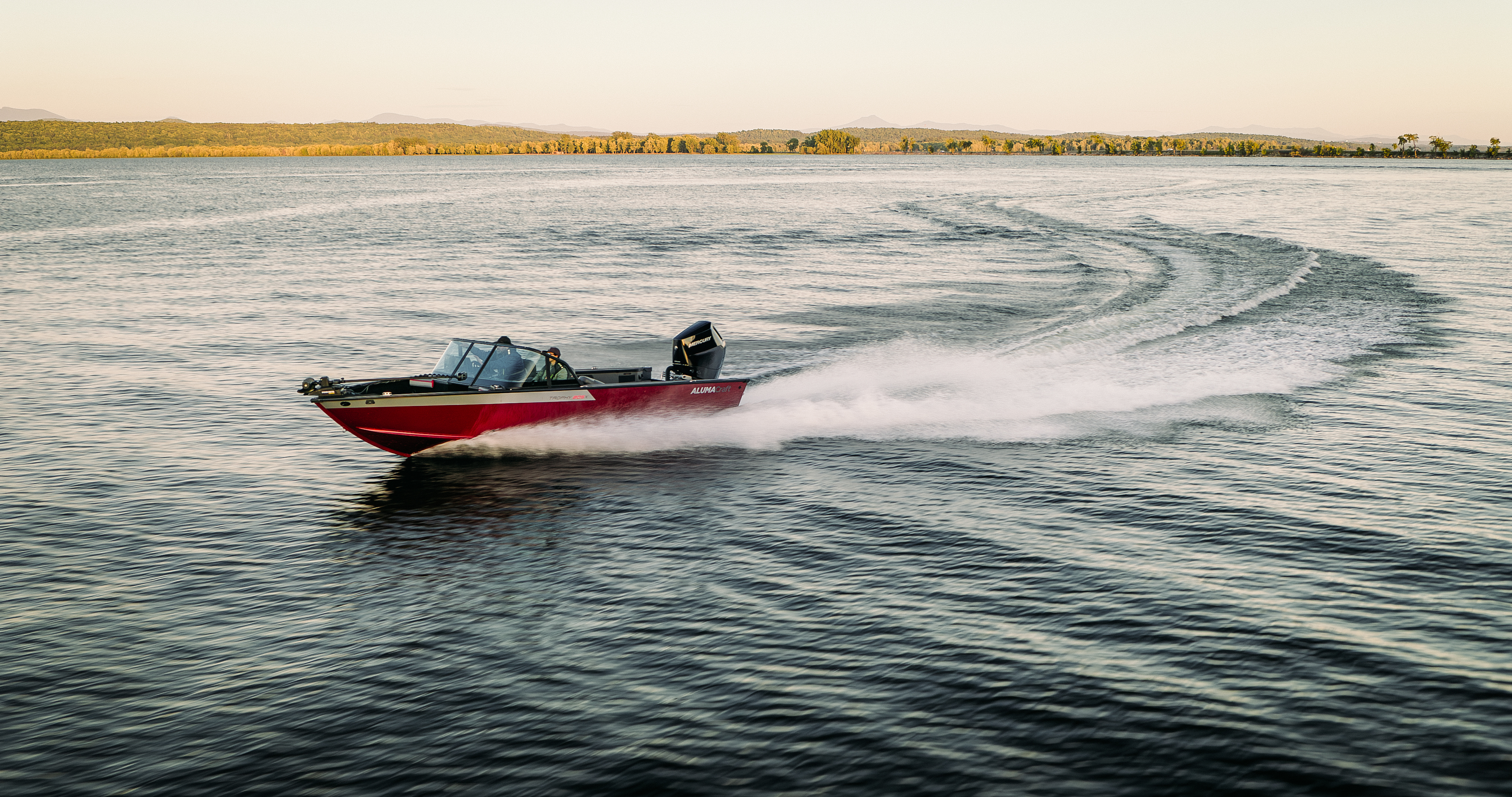 Man with his son fishing from an Alumacraft aluminum fishing boat