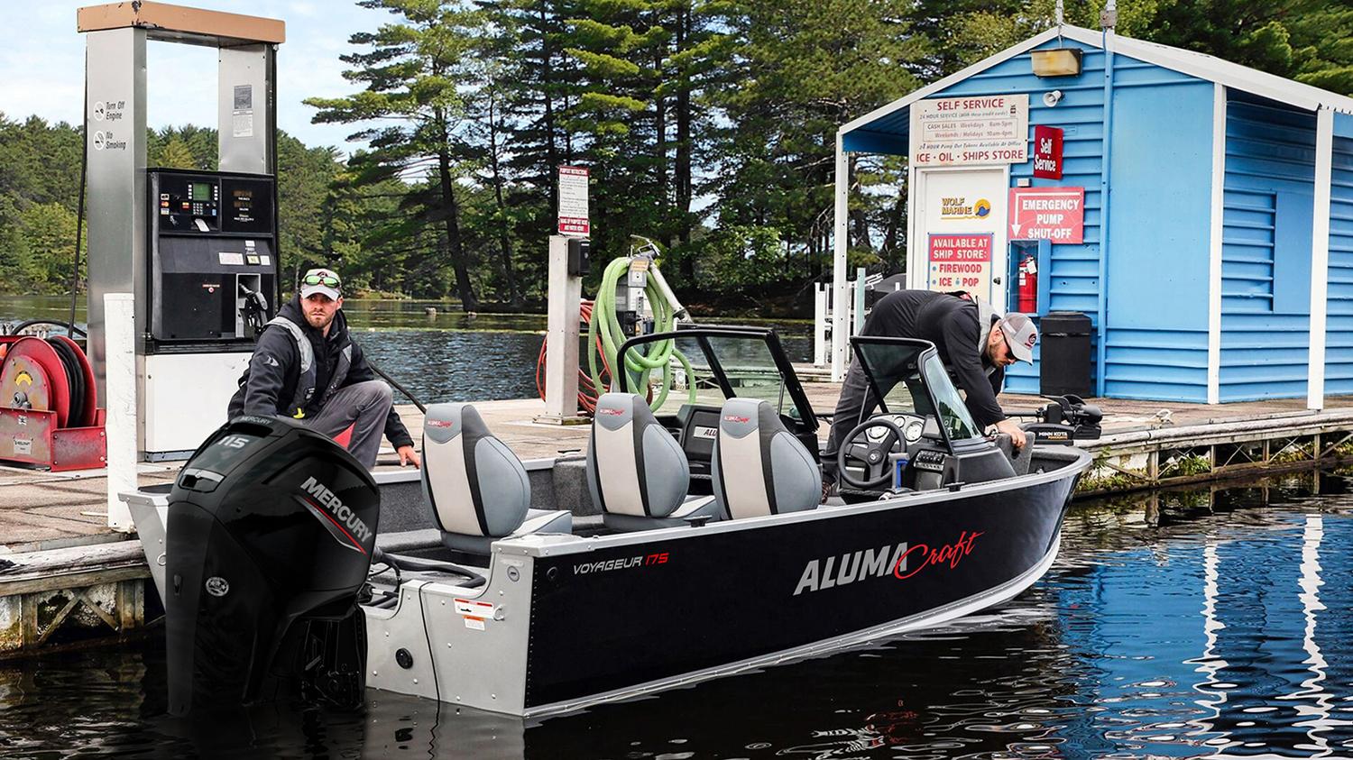 two fishing anglers loading safety gear at the fuel dock