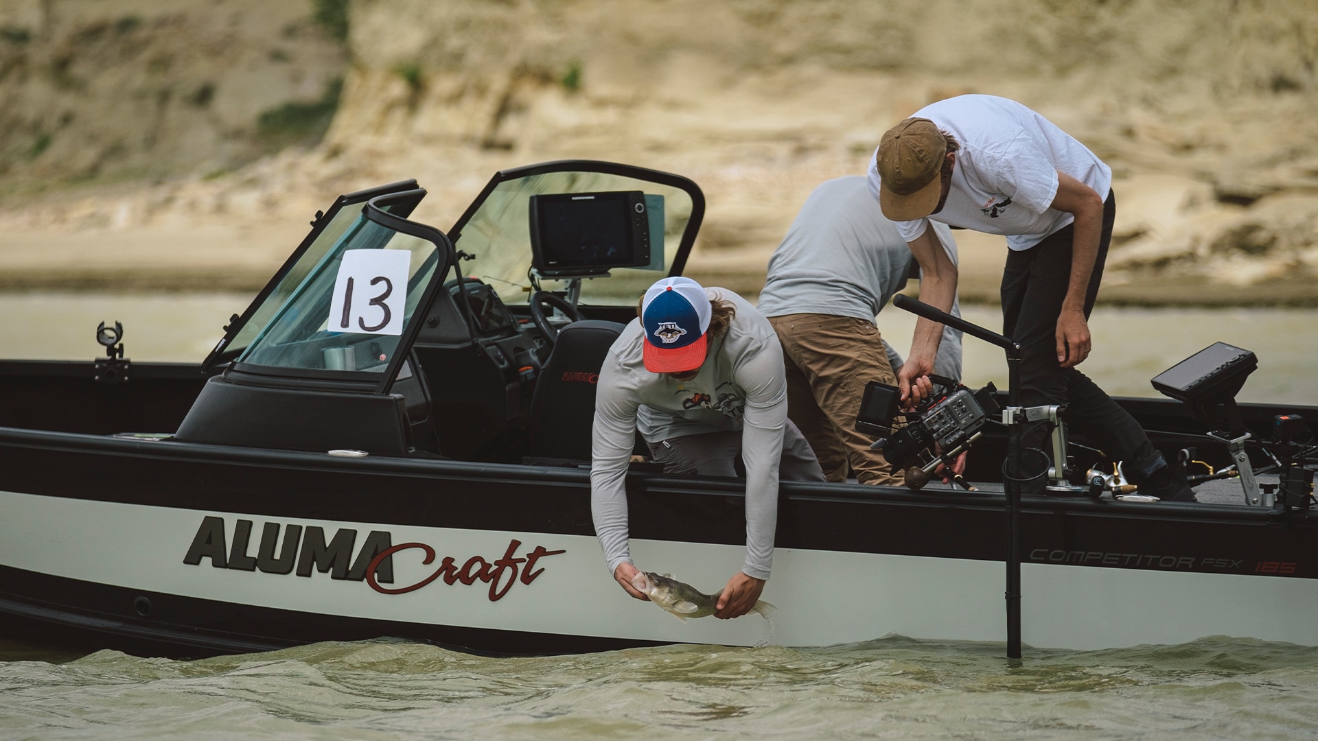 Seth and Chester fishing in Alumacraft Competitor FSX 