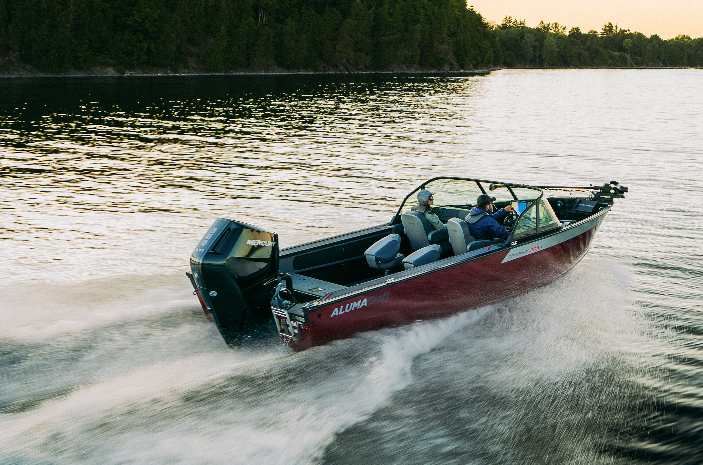 Man with his son fishing from an Alumacraft aluminum fishing boat