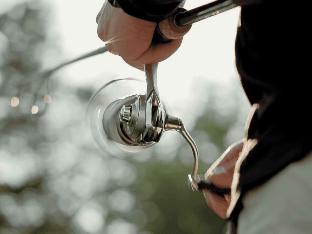 Close-up of Jay Siemens' hands on a fishing reel