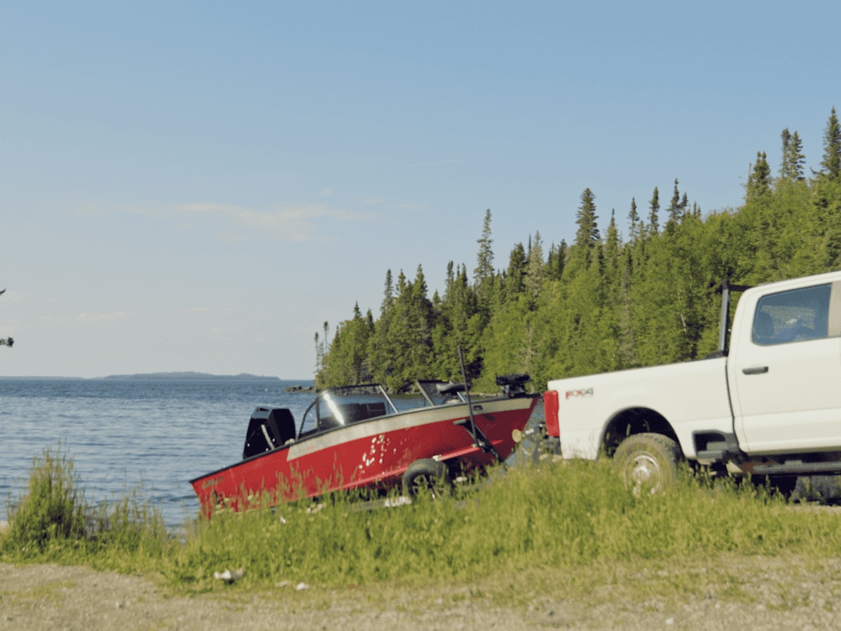 A car that launches a red Alumacraft boat